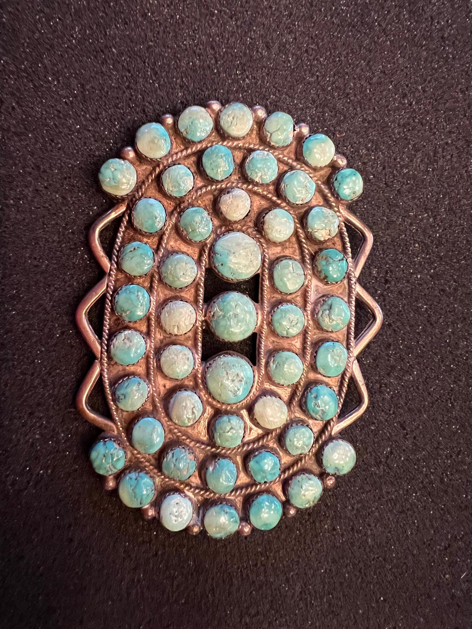 Large Navajo Pawn Cluster Broach: Large Navajo cluster broach with beautifully aged and matched stones. 4 inches by 2 - 3/4 inches, signed NJ, possibly Nila Johnson. Weight 79 grams.