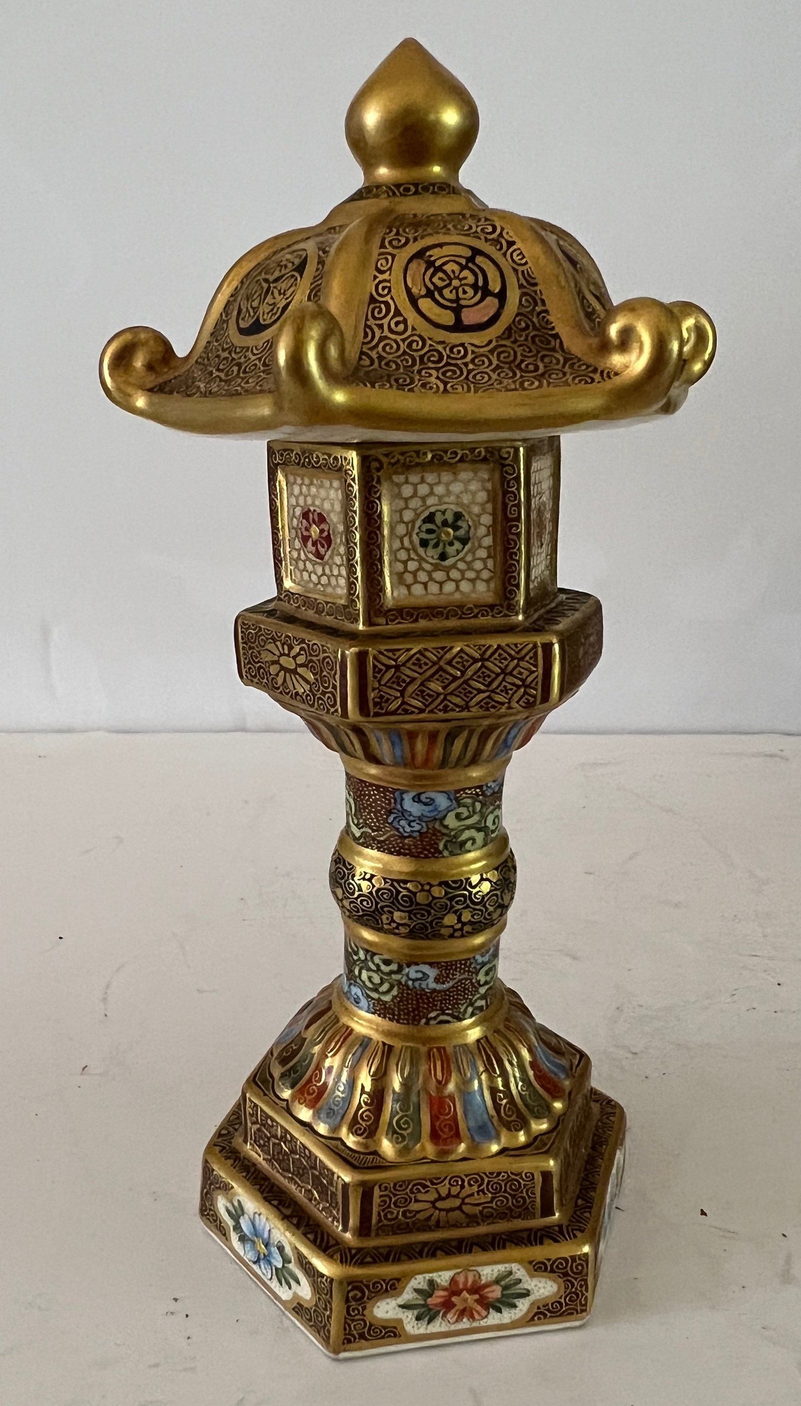 Miniature Imperial Satsuma Pagoda: 6 inches high x 3 inches across the top x 2..5 inches across the base. There is a chip on the interior of the top which is not visible..