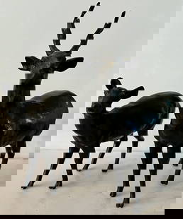 Pair of Bronze Deer, Japan, Meiji Period: Exquisite pair of Japanese bronze Okimono of deer, possibly Meiji period, realistically cast as a buck and a doe, each in mid-step and signed on the underside [unread] (buck with rear leg repaired), 9