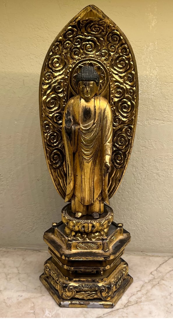 Japanese Amida Nyorai Amitabha, Edo/Meiji: A beautifully carved wooden figure of Amida Nyorai, finished in traditional Japanese Kinkpaku (gold leaf) over a black lacquer base. The Buddha is depicted in a standing posture (tate-Amida), characte