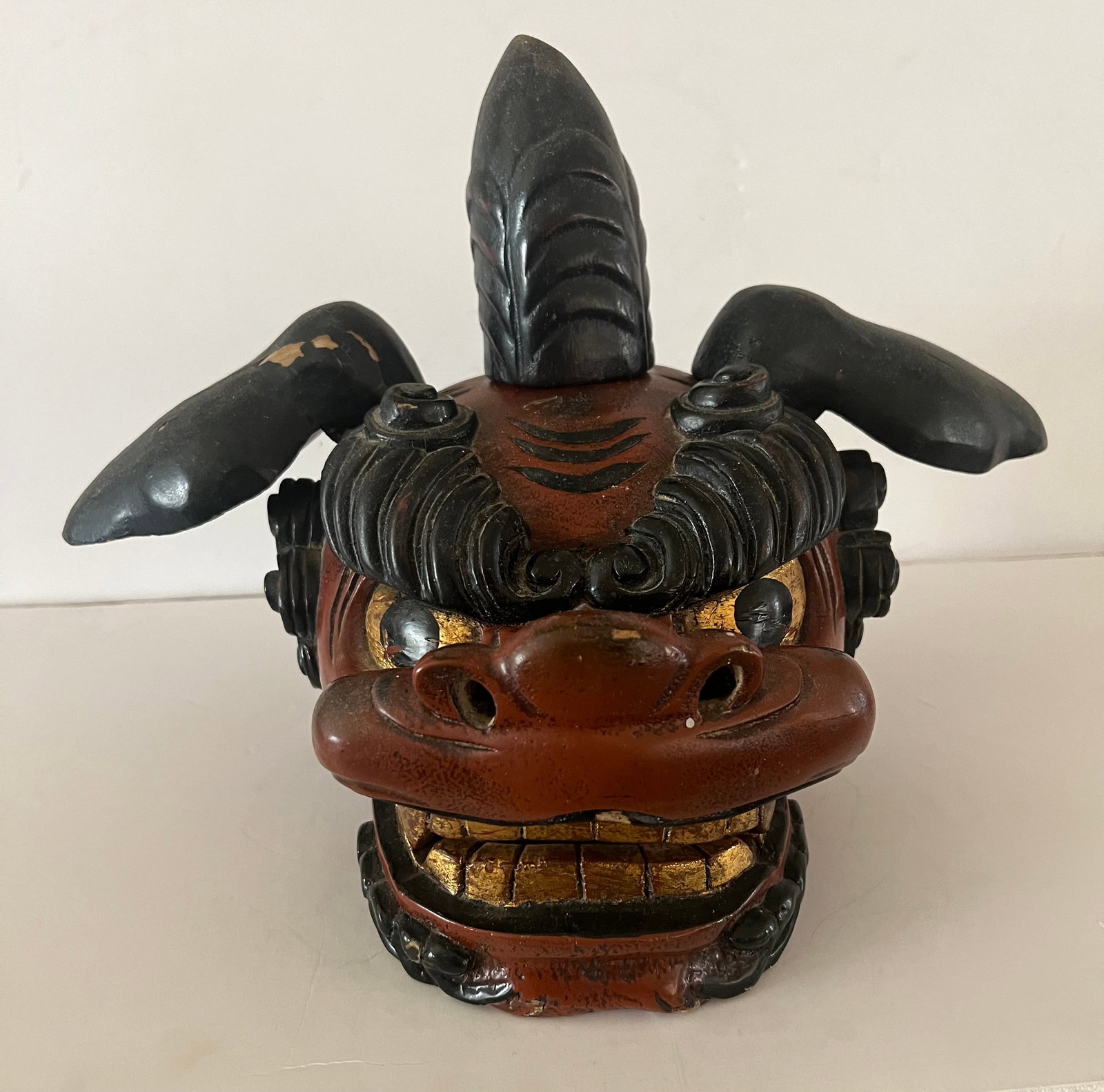 Shishigashira Mask, Meiji Period: Well-carved, Meiji period Shishigashira mask with articulated jaw. 10 inches high x 15 inches wide x 7 inches deep.