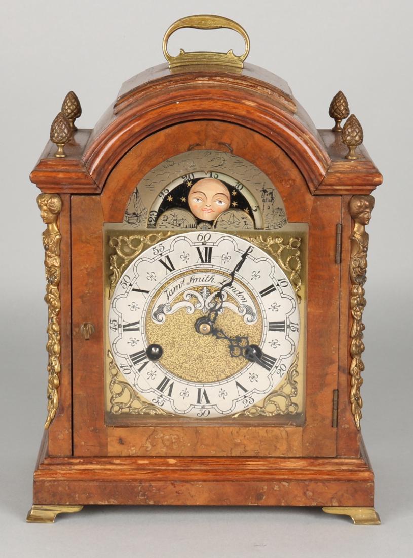 Carrot nut table clock with bronze ornaments and moon p: Carrot nut table clock with bronze ornaments and moon phase. 20th century. James Smith London. Size: 28 x 20 x 13 cm. In good condition.