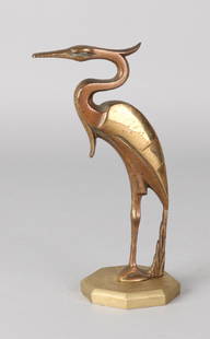 A stylized bronze heron on an iron base. Partly gilded. Attributed to Johannes B: A stylized bronze heron on an iron base. Partly gilded. Attributed to Johannes Bosma. 1879 - 1960. Size: 16 cm. In good condition.