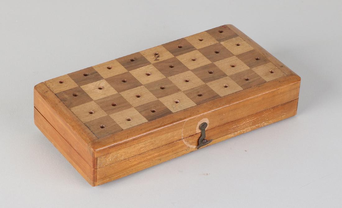Old mini chess game with bone playing pieces. Mid 20th: Old mini chess game with bone playing pieces. Mid 20th century. Size: 1.5 x 15.3 x 15.3 cm. In good condition.