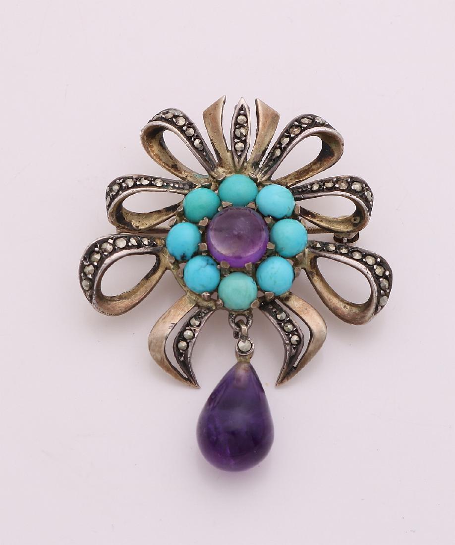 Gold-plated brooch / pendant, set with turquoise and: Gold-plated brooch / pendant, set with turquoise and amethyst, in flower form set with various markesites. 40x48 mm. In good condition