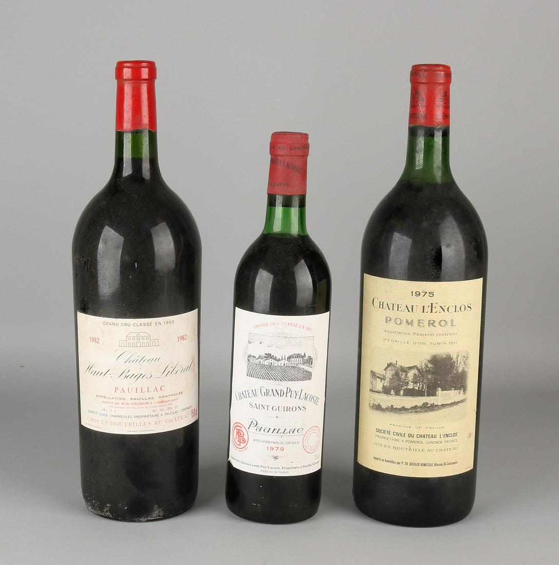 Three bottles of red wine. Comprising: 1975 Chateau L: Three bottles of red wine. Comprising: 1975 Chateau L 'enclos Pomerol. 1979 Chateau Grand-Puy Lacoste Pauillac Saint Guirons. 1982 Chateau Haut Bages Liberal Pauillac. Size: 31-36 cm. In good conditio
