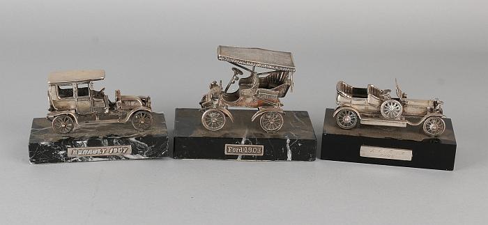 Three silver cars on basement. 835/000. A Ford 1903, a (1 of 1)