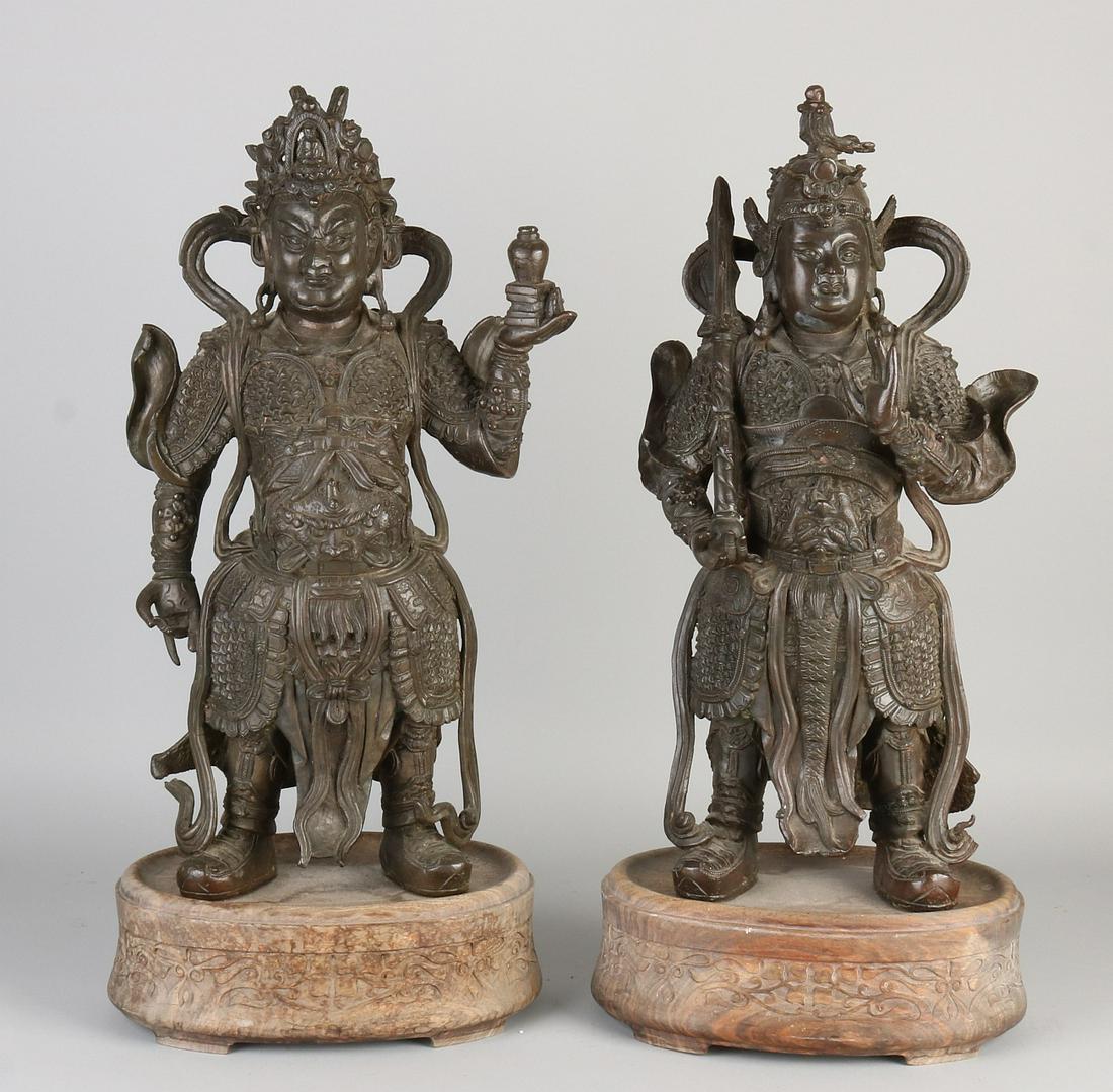 Two major Chinese bronze temple guards on wooden (1 of 2)