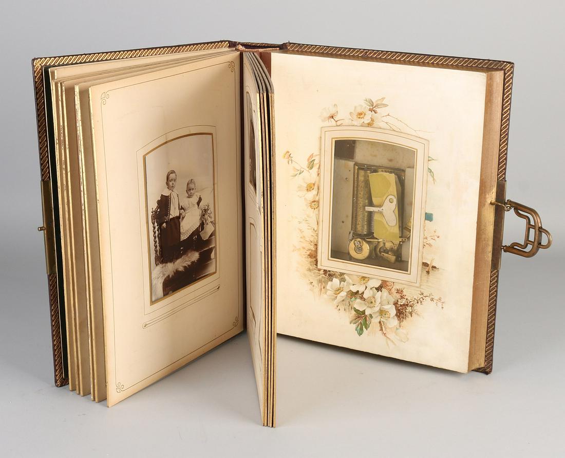 Antique book with functioning music box. Including (1 of 2)