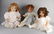 Three large German Sonneberg dolls with paper mache