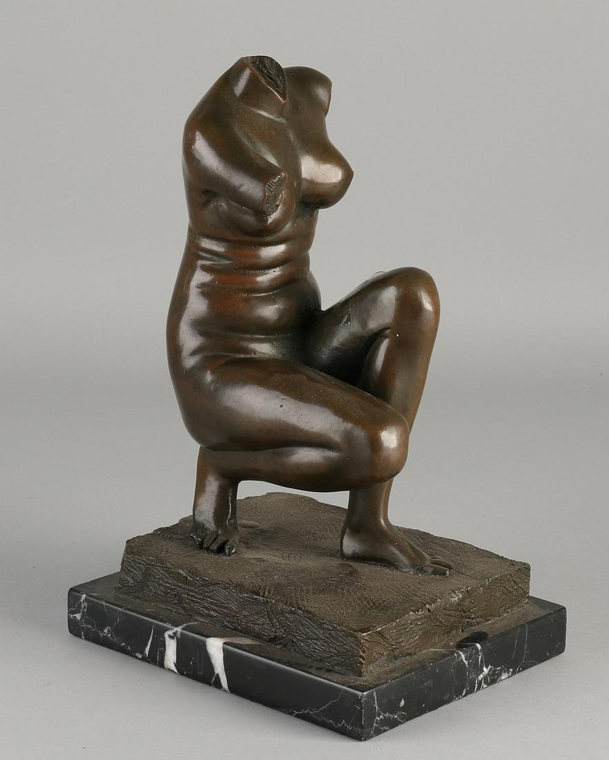 Bronze female figure on black marble base.  Second (1 of 2)