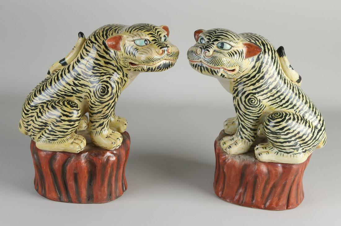 Two large Chinese porcelain tigers. Hand (1 of 3)