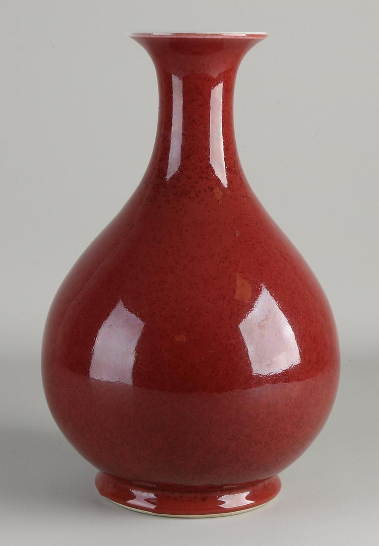 Chinese porcelain vase with red glaze. Dimensions: (1 of 2)