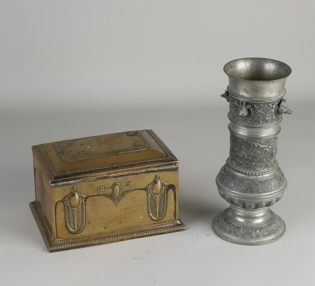 Two volumes of German antiques. 1x Jugendstil: Two volumes of German antiques. 1x Jugendstil brass WMF cookie jar, circa 1910. 1x Large historicism tin hunting goblet with hunters, wild boar head, hare head, fox head and deer head decoration.