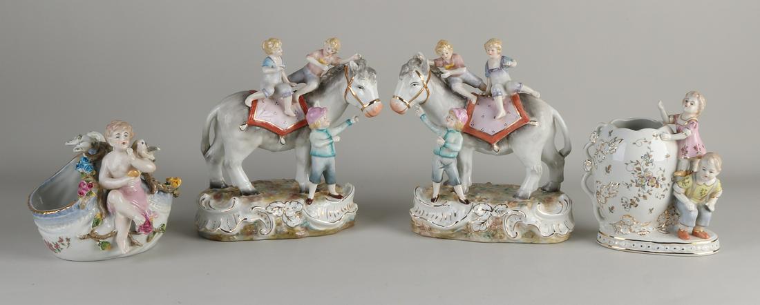 Four porcelain figure groups. Unknown bottom (1 of 1)