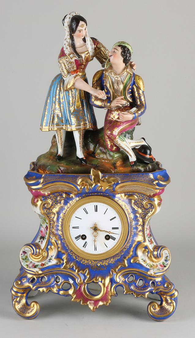 Antique two-part French porcelain Charles Dix figure: Antique two-part French porcelain Charles Dix figure mantel clock with gold decoration. Monogram JP Eight-day movement, half-hour strike, string pendulum. One hairline at the back, otherwise good. Dim