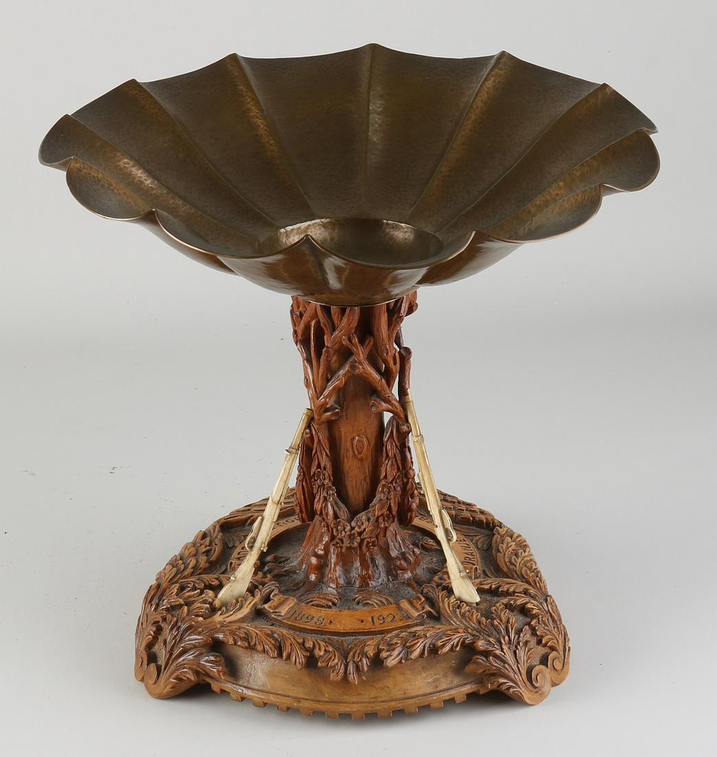 Black Forest table piece: Antique Black Forest wood-carved table centerpiece with copper hammered bowl and bone guns. Made for the Dutch market. 1898 -1923 Orange and the Netherlands Hou and Trouw. Dimensions: In good conditio