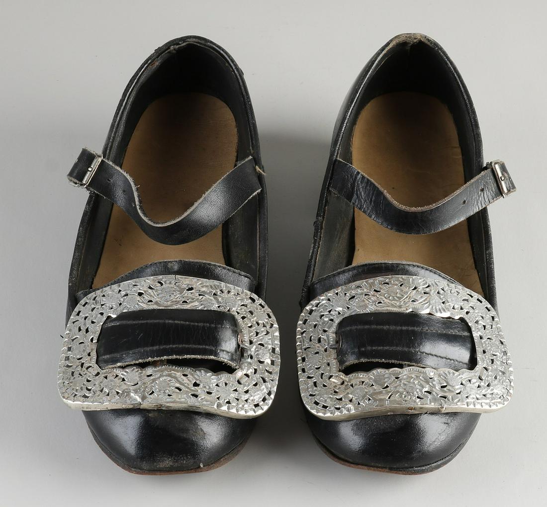Pair of shoes with silver buckles (1 of 2)