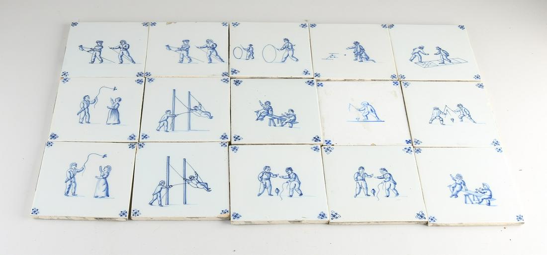 Lot of tiles (15 pcs.): Lot of antique Dutch wall tiles with children's games. Circa 1900. Some damage. Dimensions: 13 x 13 cm. In fair/good condition.
