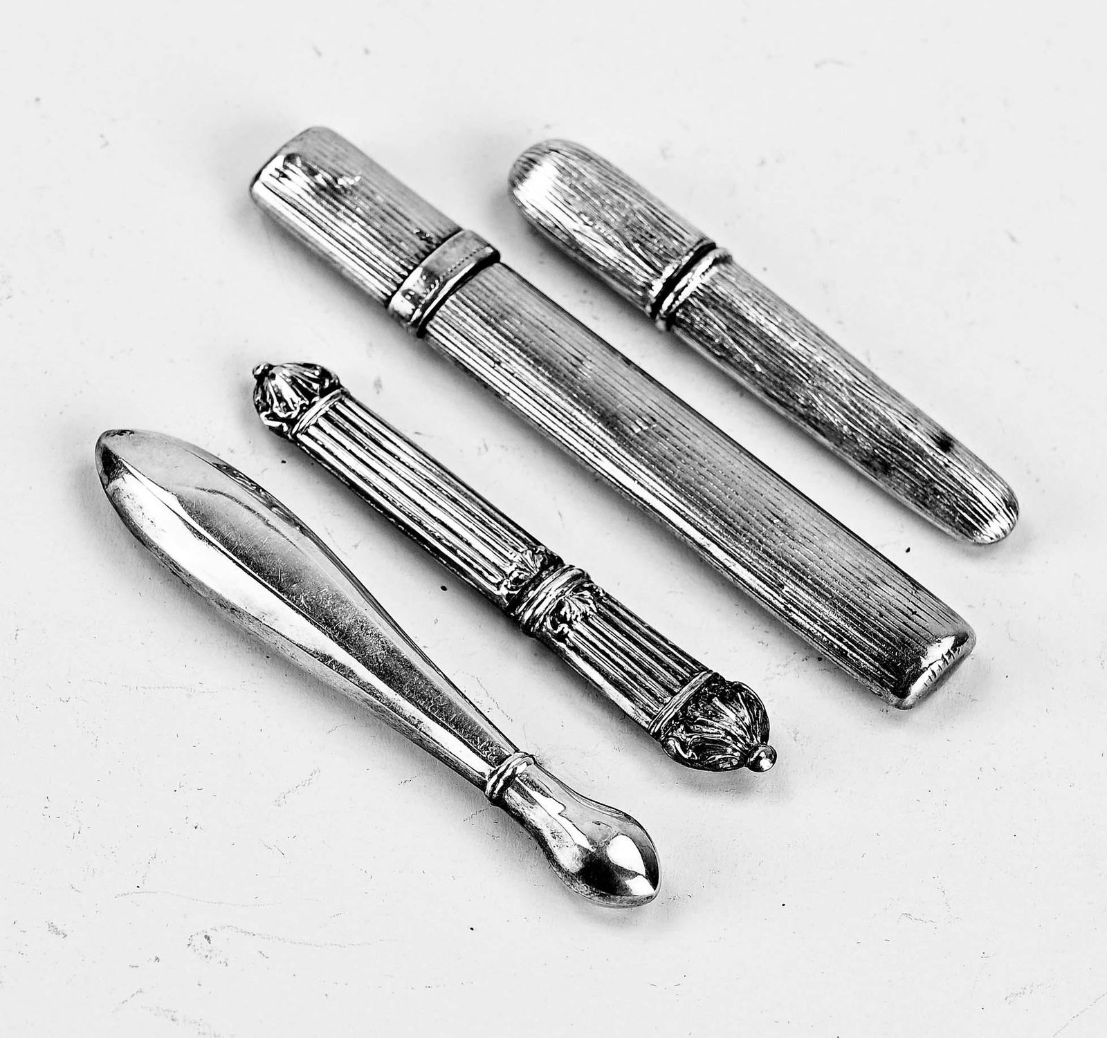 Four silver needle cases (1 of 1)