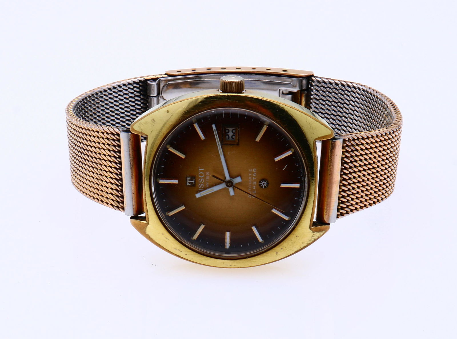Tissot watch: Tissot seastar automatic watch, with a gold-coloured round case, fitted with a smoke-brown, colored dial with white hands. Fitted with a metal strap, not original. working. width 38mm. Sixties. In goo