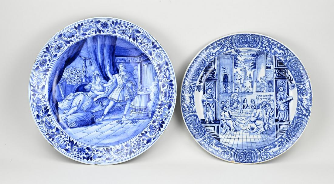 2x Dutch fayence wall plates Ã˜ 34.5 - Ã˜ 38 cm.: Two large antique Dutch fayence wall dishes. Delft + Makkum. 1x Delft, circa 1880, last supper, neo renaissance. 1x Makkum Tichelaar, circa 1880, figures in interior, edge glaze damage. Size: Ã˜ 34.