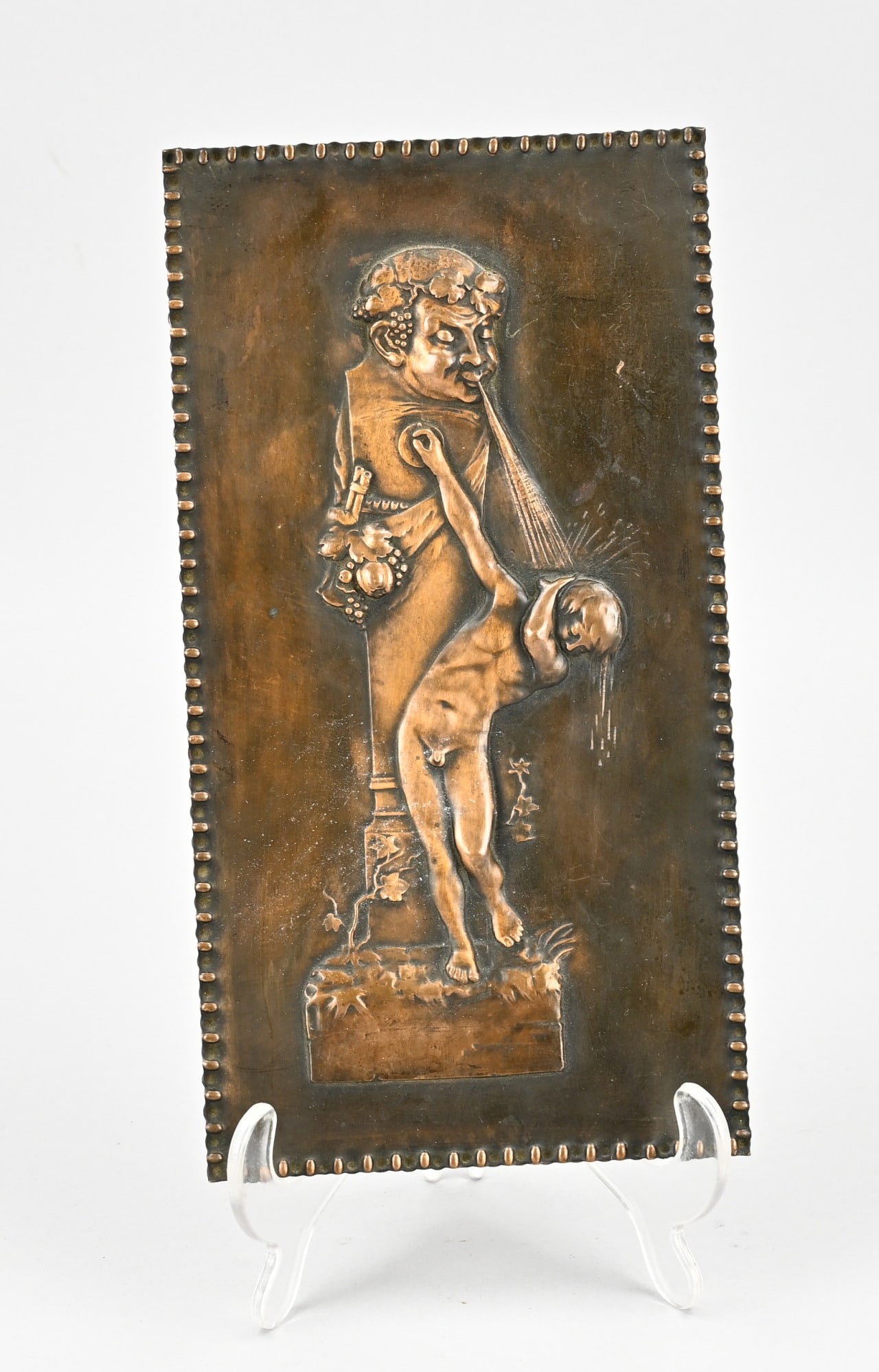 Bronze plaque, H 25.5 x W 13.5 cm.: Bronze wall plaque. Gargoyle and boy. Circa 1900. Dimensions: H 25.5 x W 13.5 cm. In good condition.