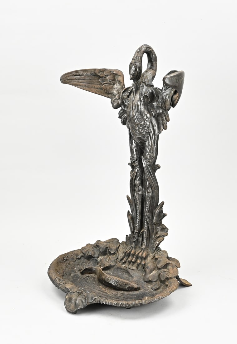 Cast iron umbrella stand: 19th century cast iron umbrella stand with crane and fish decoration. Dimensions: 53 x 32 x 27 cm. In good condition.