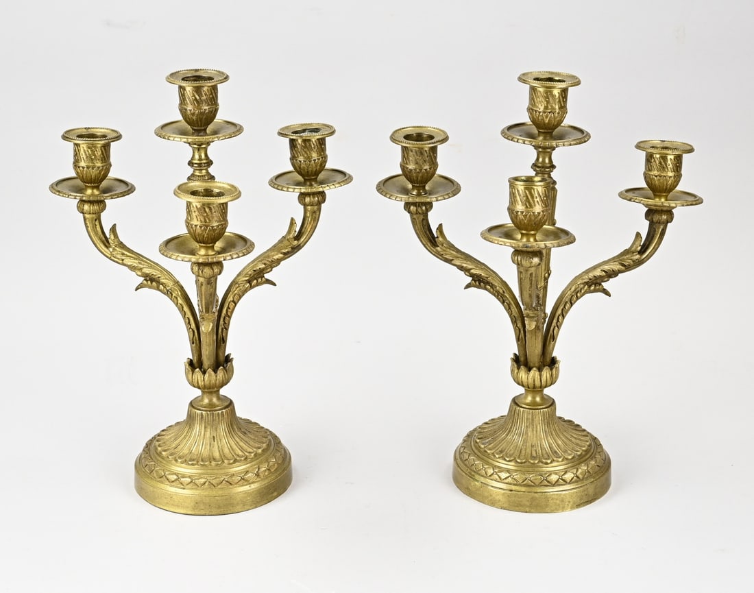 Pair of 4-light bronze candlesticks, H 33 cm.: Two antique bronze 4-light candlesticks in Louis Seize style. Dimensions: H 33 cm. In good condition.