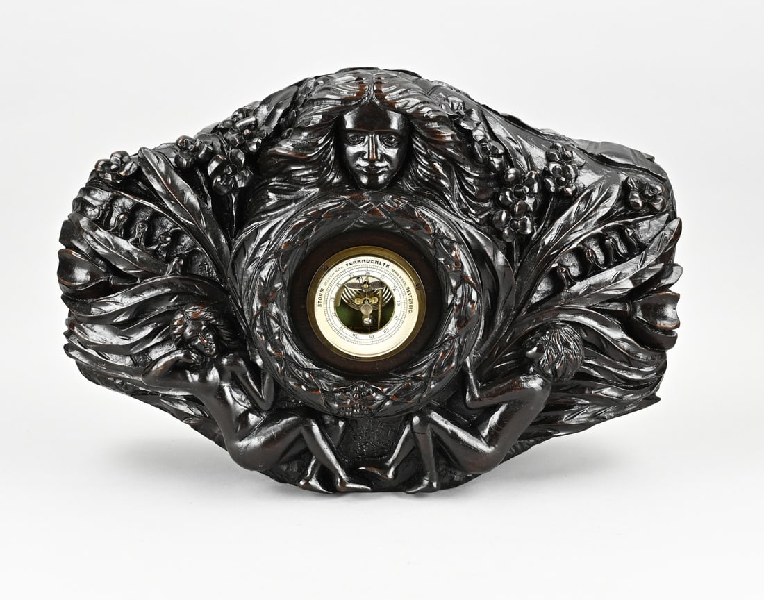 Stabbed barometer, 1910: Antique Walnut carved barometer with nude figures. Circa 1910. Dimensions: 36 x 50 x 17 cm. In good condition.