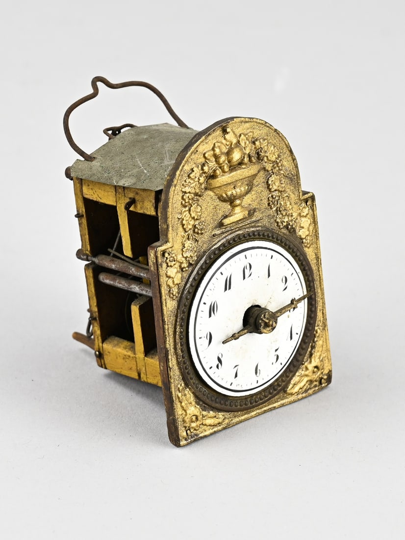 Black Forest/Jockele Clock: Small, 19th century Black Forest Sorguhr or Jockele. Striking mechanism missing part, no pendulum, no weights. Dimensions: 9 x 6 x 6 cm. In good condition.