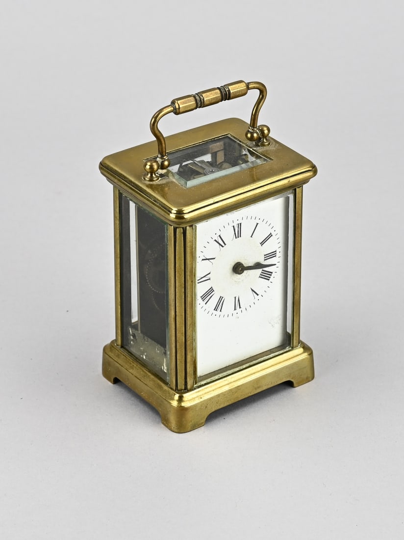 French travel alarm clock, 12 cm.: Antique brass gilt travel clock. R & C Paris. France. Circa 1900. No striking mechanism. Size: 12 cm. In good condition.