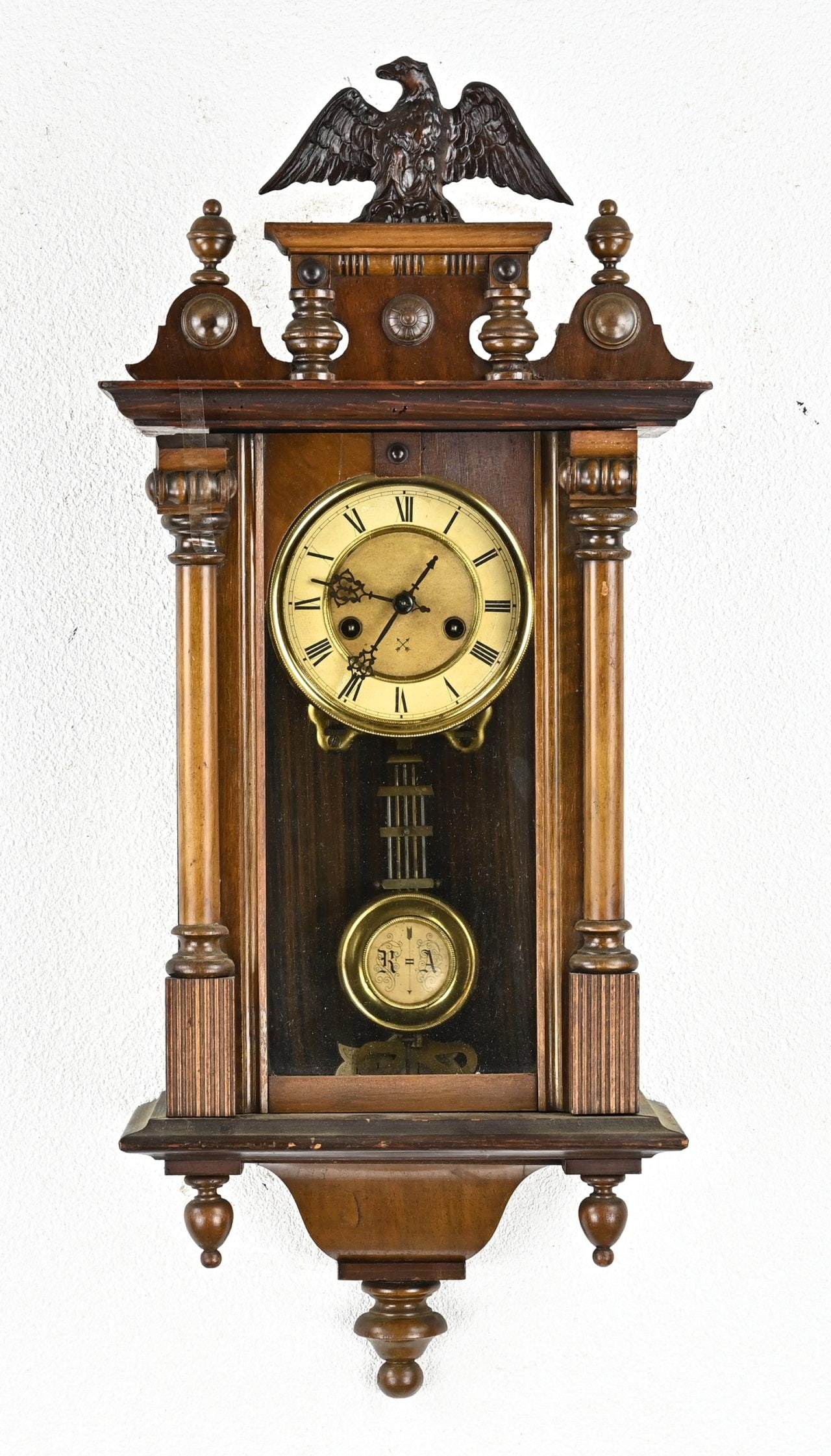 Arrow cross regulator: Pfeilkreuz regulator of walnut, with eagle on top. 19th century. Dimensions: 75 x 33 x18 cm. In reasonable/good condition.