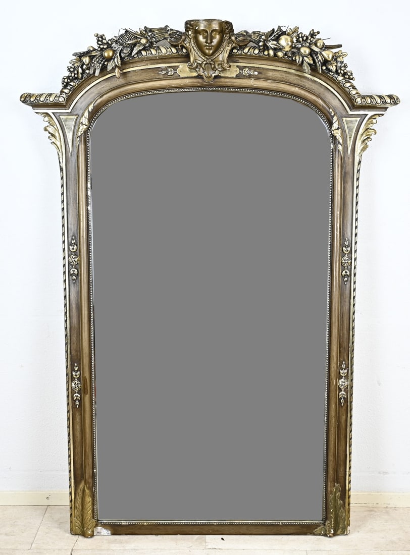 Antique hall mirror, H 170 x W 124 cm.: Very large antique hall mirror with facet cut mirror and woman's head. Top and bottom once shortened. Circa 1890. Dimensions: 170 x 124 cm. In good condition.