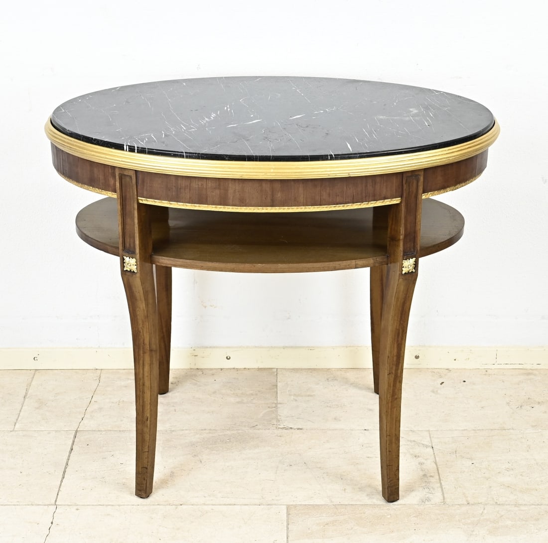 Oval table with black marble top: Late 19th century mahogany oval side table with black marble top, with gilded bronze ornaments on the corners. Dimensions: 78 x 91 x 61 cm. In good condition.