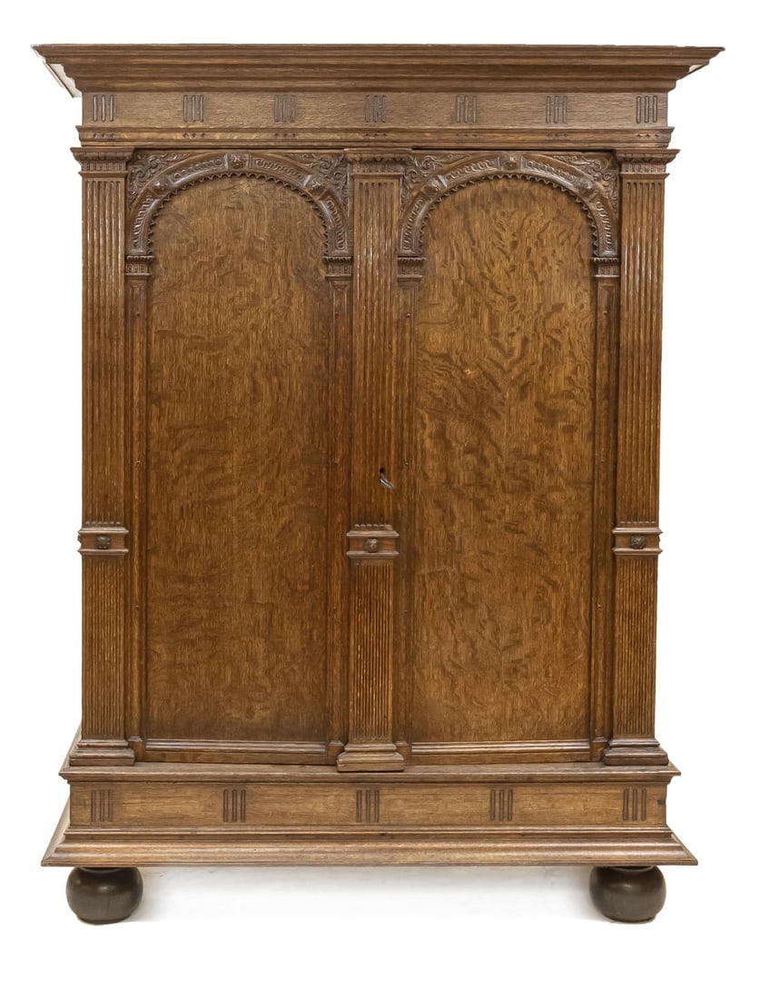 Oak renaissance cabinet: 18th century oak Dutch Renaissance cabinet, also called Utrecht gate cabinet. With beautiful carvings on the doors and sides with lion heads. Cabinet standing entirely on black ball feet. Original