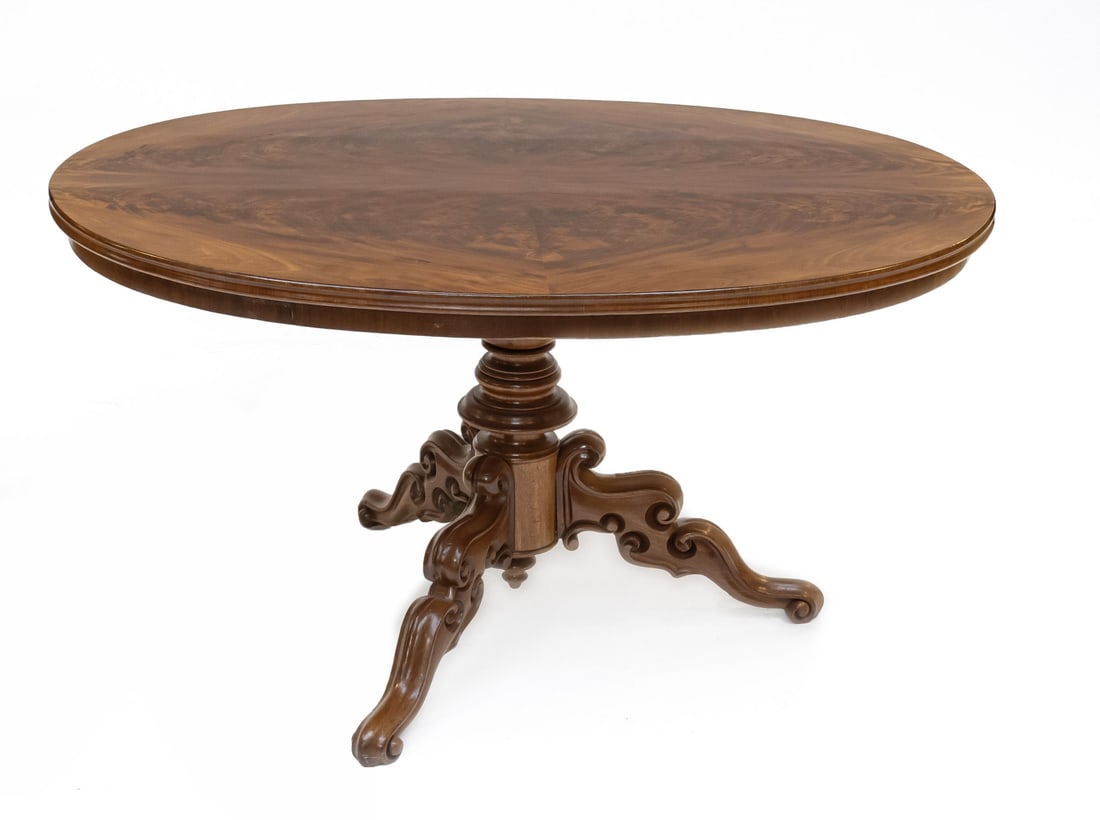 Oval coffee table, 1870: 19th century walnut Louis Philippe coffee table. Standing on beautifully crafted tripod. Circa 1870. Dimensions: 120 x 80 x 61 cm. In very good condition.
