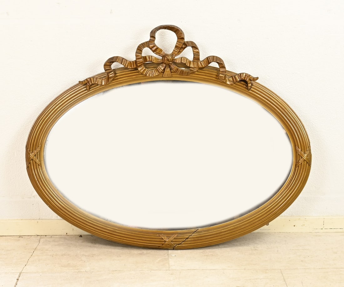 Mirror with bow, 1900: Antique oval mirror in Louis Seize style. Circa 1900. Dimensions: 74 x 44 cm. In good condition.