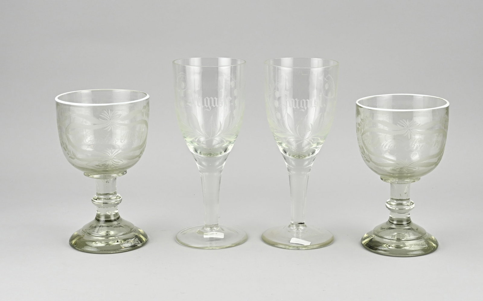 Four goblet glasses: Four 19th century German engraved goblet glasses. Thick-walled. Mouth-blown. Size: 8.5 - 23 cm. In good condition.