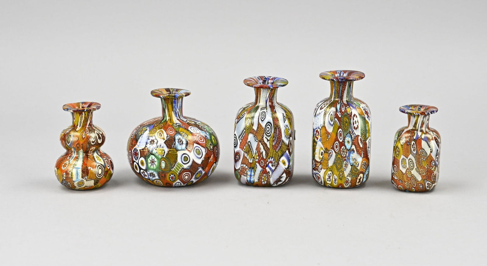 5x Bottle: Five glass bottles with Mille Fiori decor. 20th century. Size: 6.5 - 9 cm. In good condition.