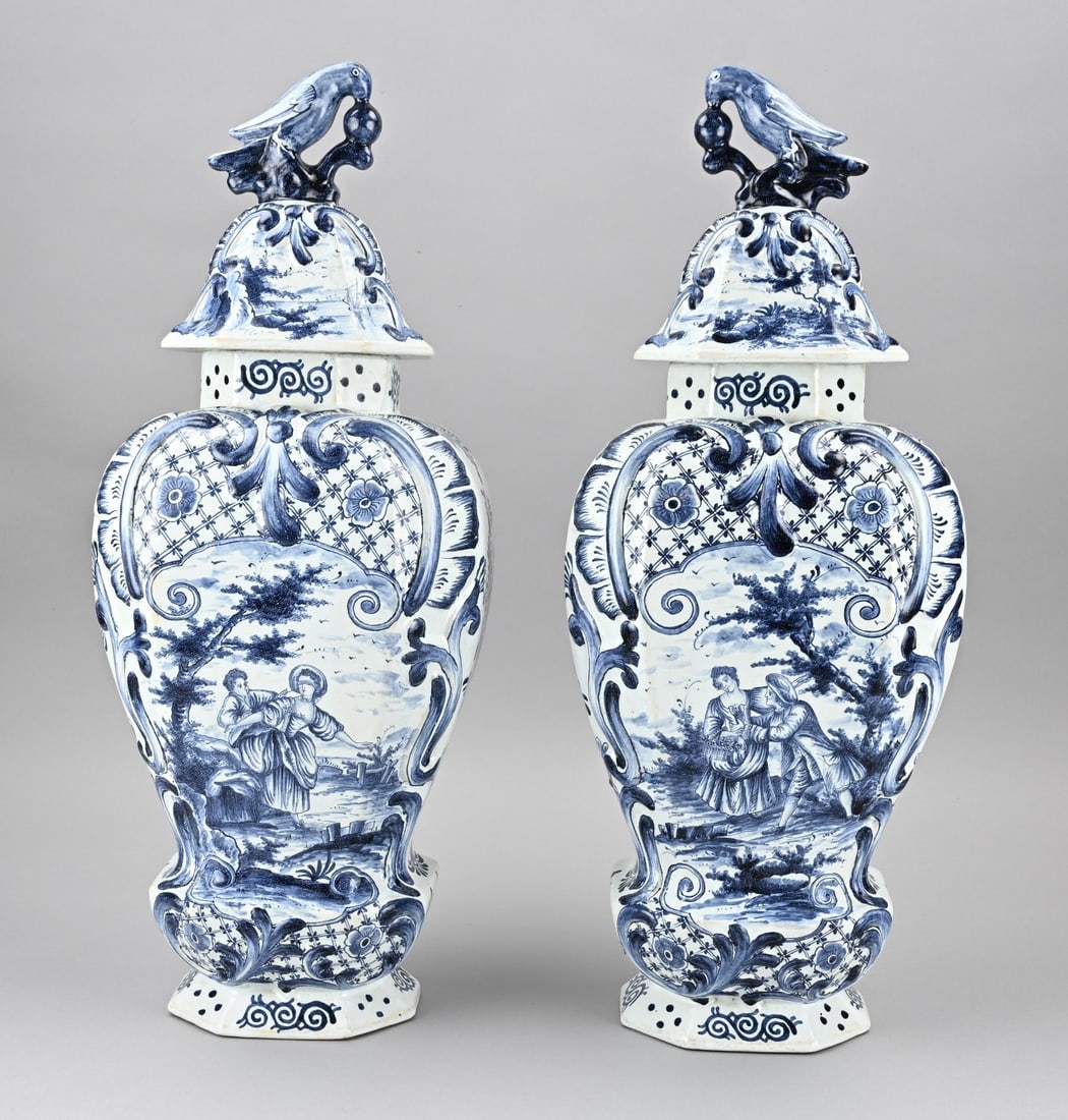 Set of large Delft vases: Two very large antique Delft faience covered vases with floral + romantic figures decoration. Bottom mark W. Dimensions: H 57 cm. In good condition.