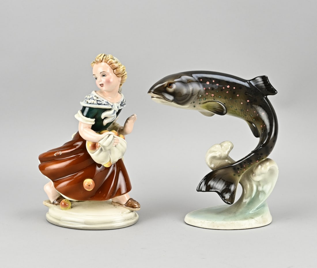 Two pieces of Viennese porcelain: Two antique Viennese ceramic figures. Circa 1900 - 1920. Girl with apples (Wien Keramos). Trout (Wien Keramos). Size: 20 - 22 cm.