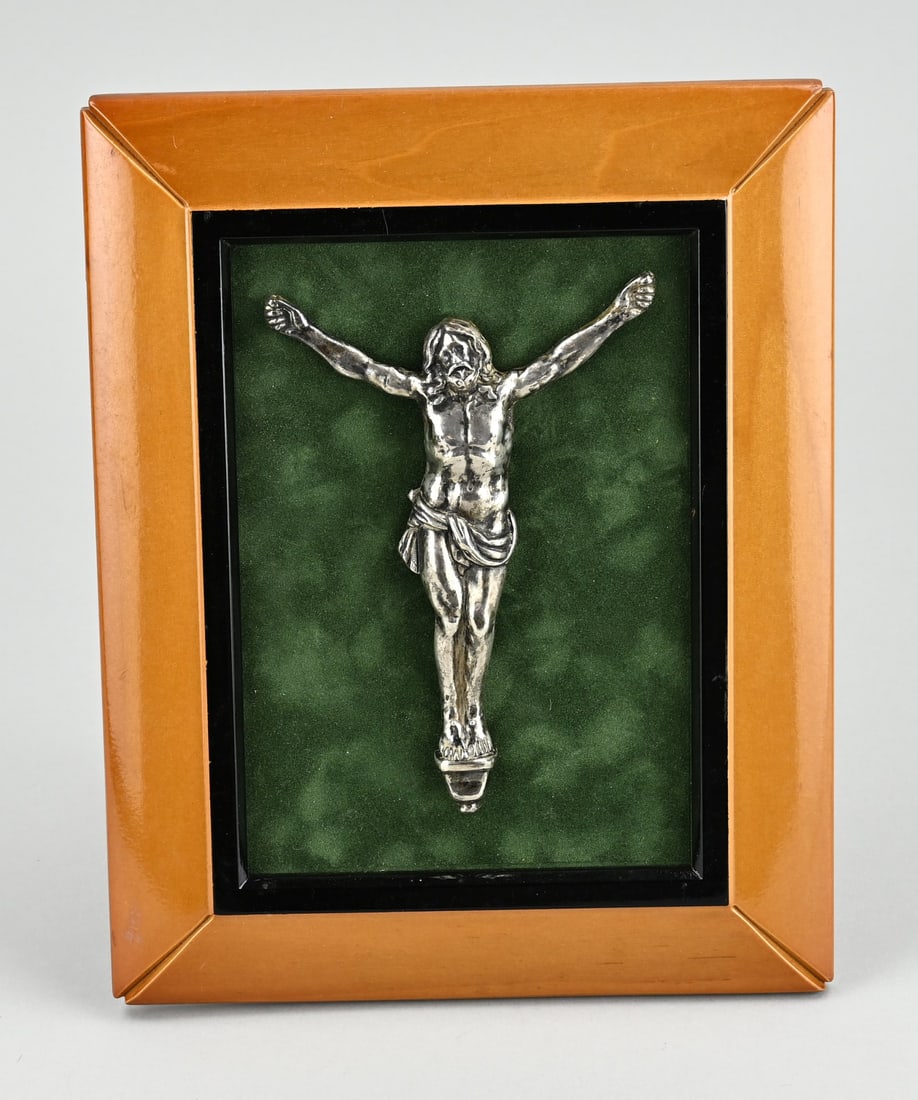 Silver crucifix in art deco frame: Silver antique crucifix mounted on a green velvet base and in an Art Deco frame. 24x19cm. In good condition.