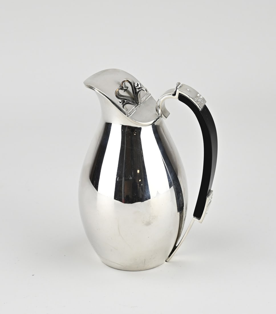 Silver jug, wooden handle: Sleek silver jug, 830/000, Danish, jug with a round belly and a hinged lid with a curl decoration as a knob. The jug has a black ebony handle. MT.: J.Sigsgaard, Statsguardein, Denmark, 1930.