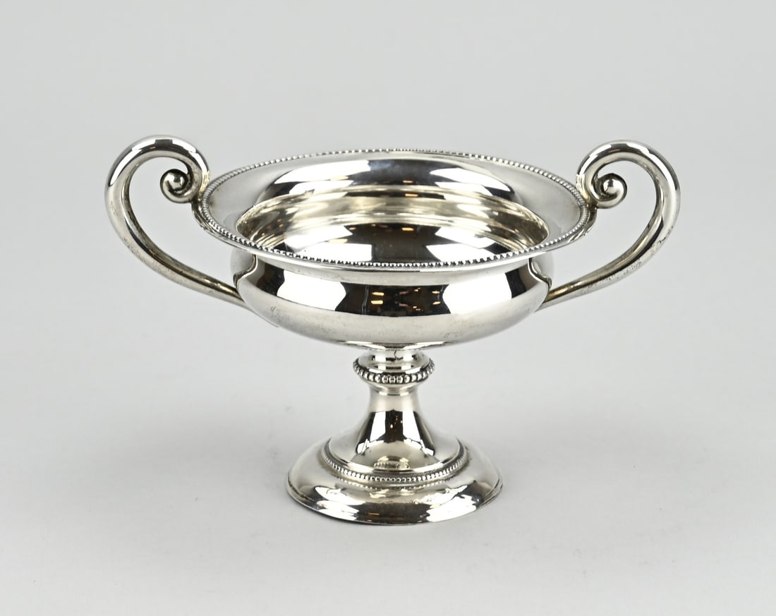 Silver sugar bowl: Silver sugar bowl, 833/000, round bowl, placed on a round foot decorated. The sugar bowl is decorated with 2 pearl edges and 2 curled handles. 16x11.5x10.5cm. MT.: JM van Kempen, Voorschoten.