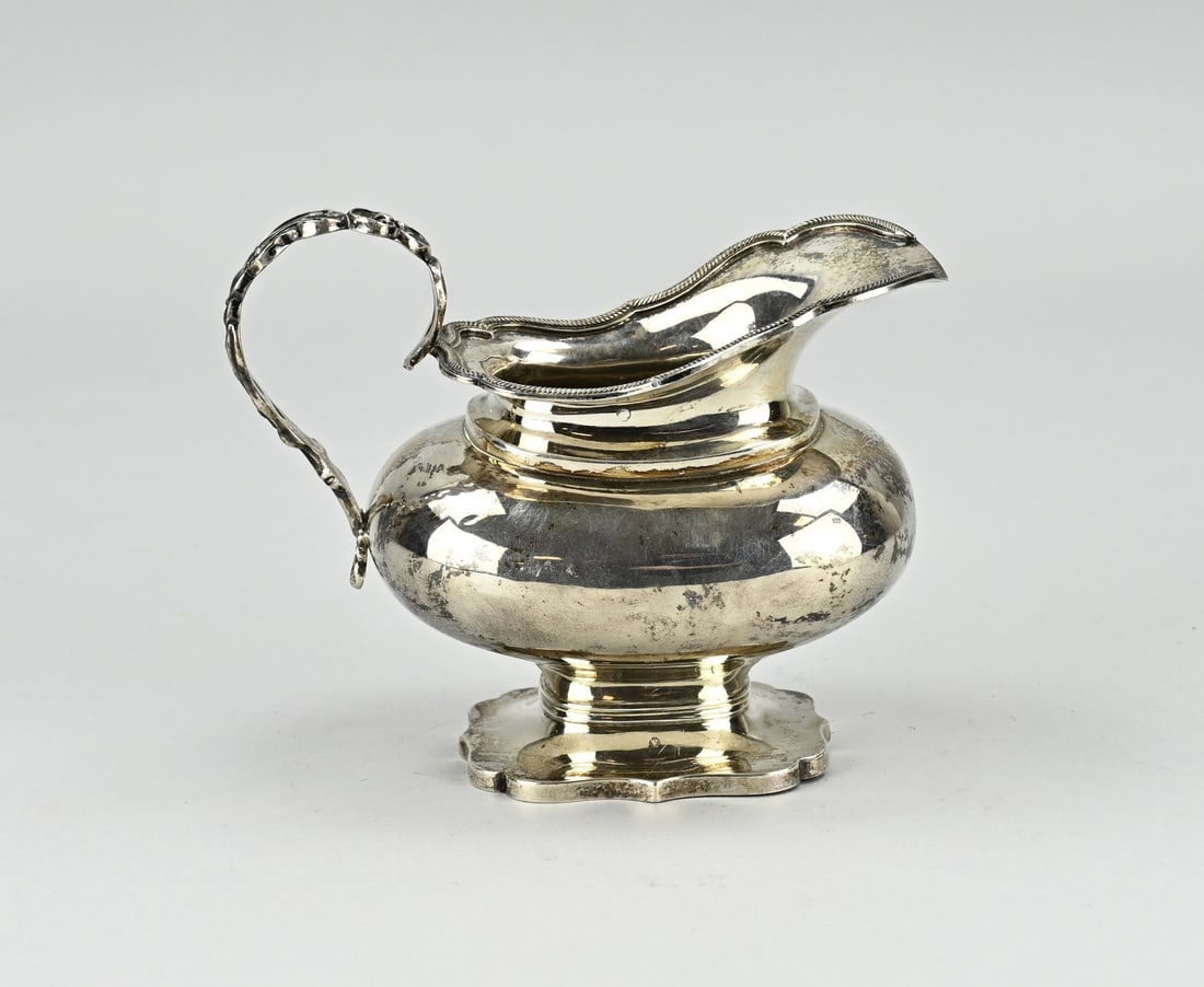 Silver cream jug, Bonebakker: Special silver cream jug, 934/000, rectangular contoured model, with beautiful openwork handle and a rim with a twisted finish. Mr. Pieterse and A. Bonebakker & Zn. - Amsterdam. Year 1858. Also