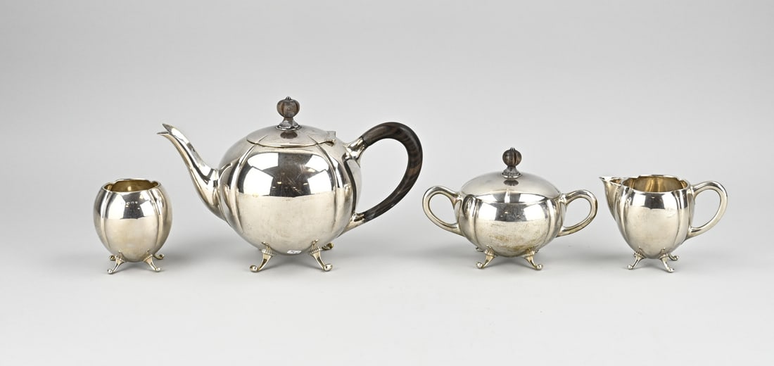 Silver tableware, 4 pieces: Silver tea set, 835/000, 4 pieces. A teapot, milk jug, sugar bowl and a spoon vase, melon-shaped. The teapot has a wooden handle and knob. The sugar bowl with lid has a wooden knob. All parts are
