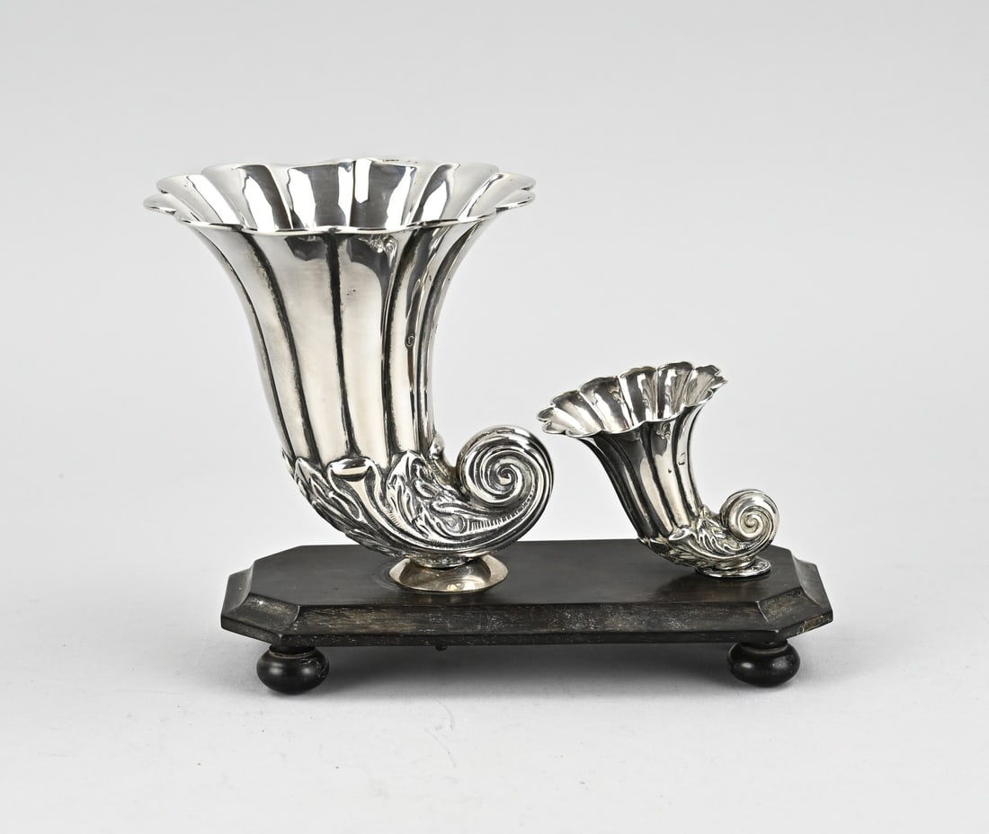 Silver cigar cup: Silver cigarette cup, 833/000, on a wooden base. Wooden rectangular base with 2 silver horns on it, decorated with acanthus leaves. MT.; Probably J.Schalkwijk, Rotterdam, jl.: M: 1846. Gross 250