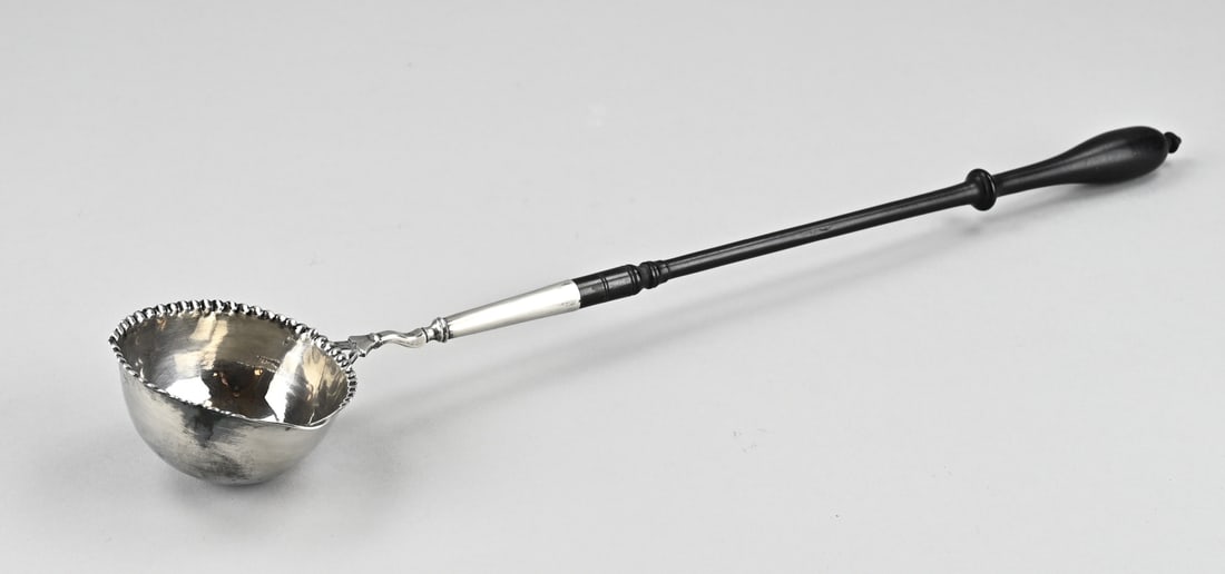 Silver morello cherries spoon: Antique silver spoon, with a round bowl with a spout and a pearl rim attached to a wooden handle. Provided with a restoration to the bowl. Bowl slightly out of shape otherwise in good condition. 39