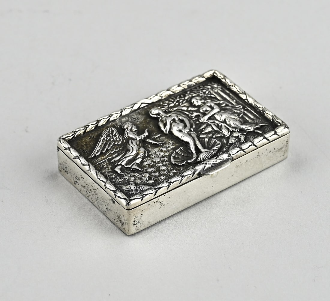 Silver peppermint box: Silver peppermint box, 833/000, square contoured model with engraving and ribbed decoration. On the top with engraving: Souvernir. MT.: wed. AGKooiman, Schoonhoven, jl.: U:1854. 4.5x4.5x1.5cm.